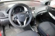 Красный Hyundai Solaris 1.4 AT (107 л.с.) 2014 фото 9